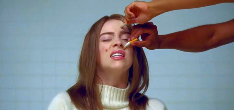 Billie Eilish tem o rosto queimado por cigarros em seu primeiro vídeo como diretora